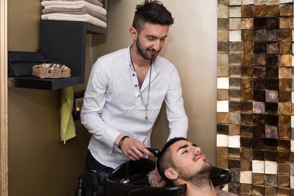 Portrait Of Male Client Getting His Hair Washed