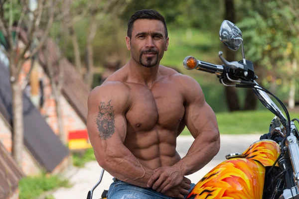 Muscular Man And Motorcycle