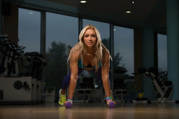 Middle Age Woman Exercising Push Ups