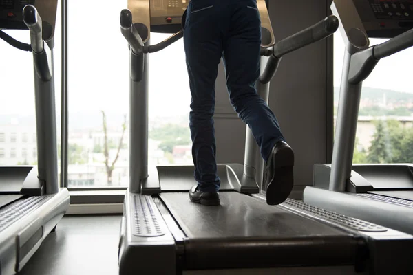 Businessman Running On Treadmill In Gym
