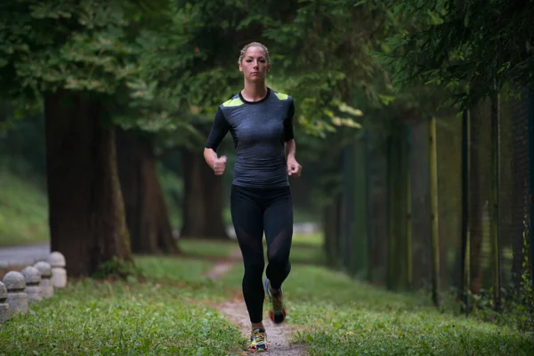 Young Woman Running Outdoors On A Lovely Day