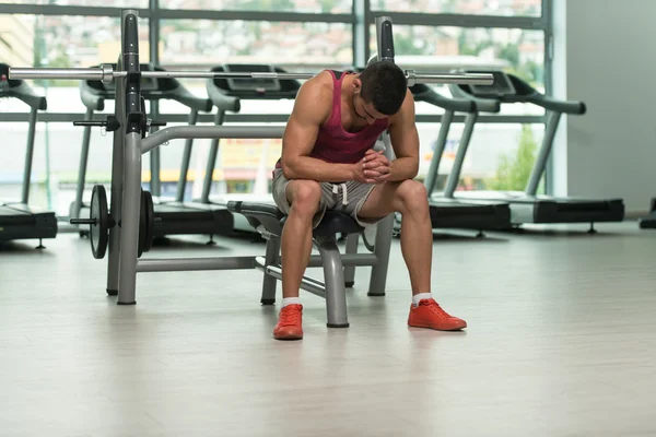 Attractive Young Man Resting Relaxed In Gym