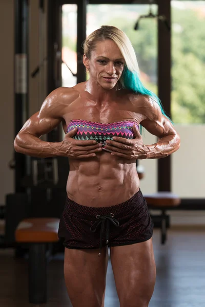 Muscular Middle Aged Woman Flexing Muscles