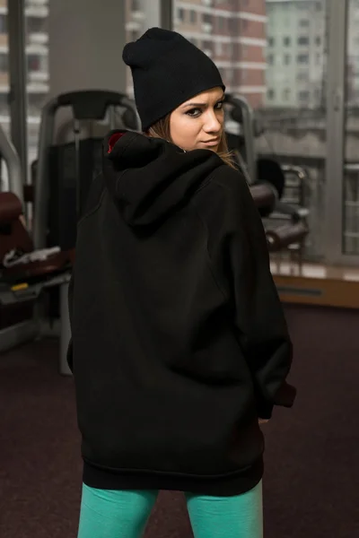 Young Sexy Woman In Black Jacket With Hood