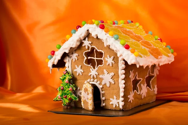 Christmas glazed gingerbread house with sweet pine.