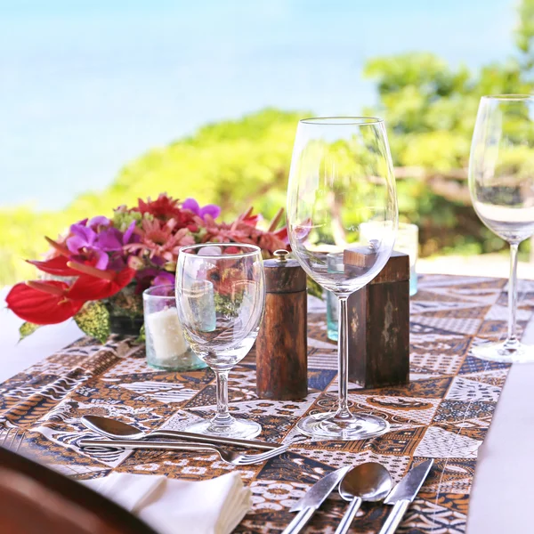 Table in the restaurant on the sea background