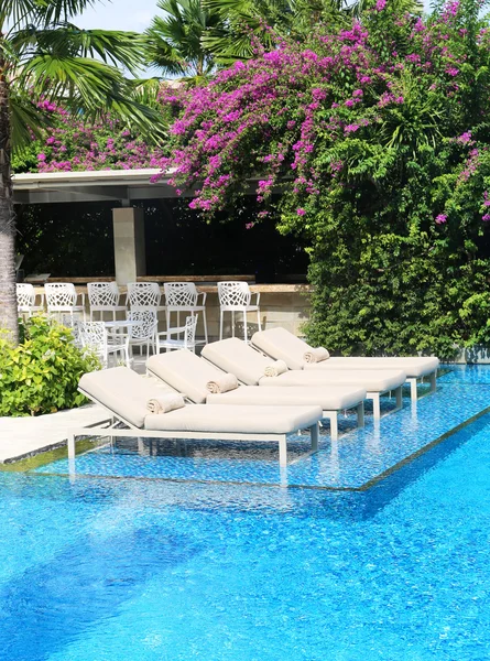 Chair side swimming pool