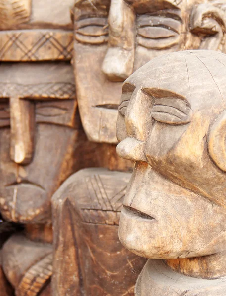 Wooden carved  ritual  statue face. Selective focus