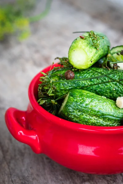 Cucumbers in a red bowl