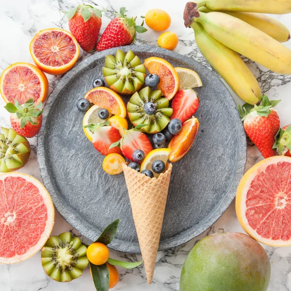 Ice cream cone with fresh fruits