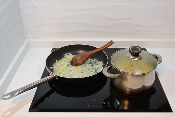 Fried onions in a pan