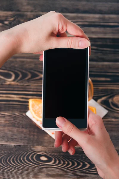 Hands Taking Photo of Oranges. Technology Concept