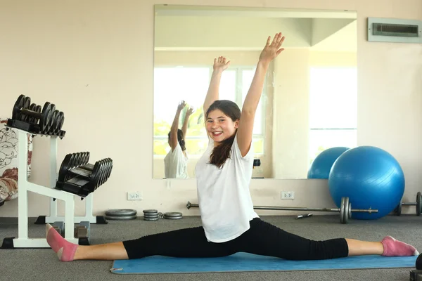 Girl has lesson yoga class  stretching  exercise