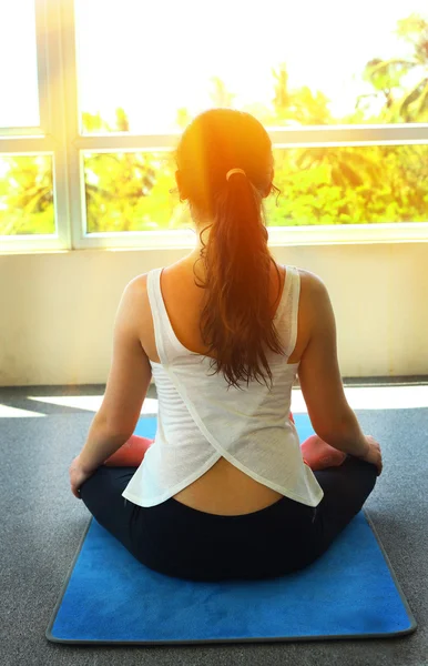 Teenager girl sit in lotus yoga asana position