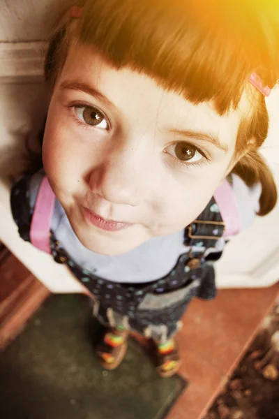 Little girl foreshortening close up portrait