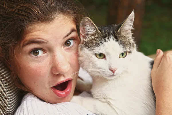 Teen girl hug cat close up portrait