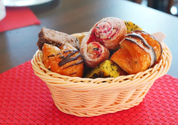 Pastry in the wicker  basket on the red mat