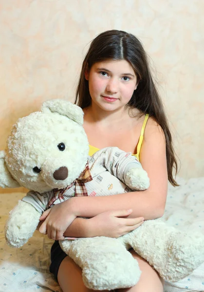 Beautiful teen girl hug teddy bear