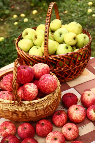 Fresh  ripe red cut apples in basket on the table