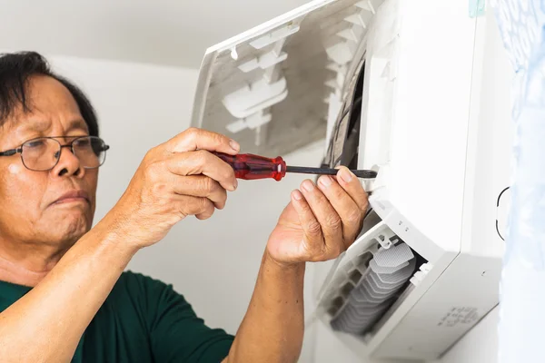 Man repair air conditioner
