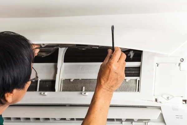 Man repair air conditioner