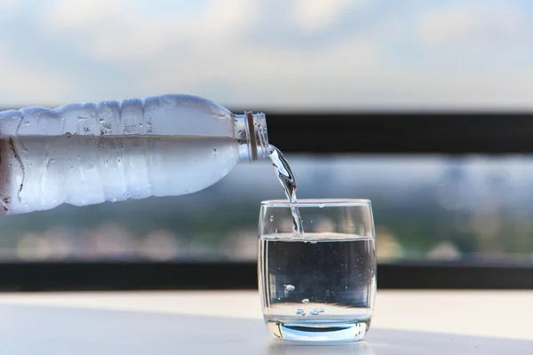 Glass of water and bottle