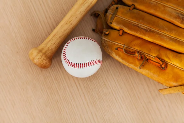 Baseball equipment on wood background