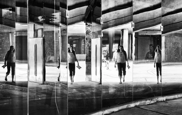 Montreal,Canada-Jul 27: silhoute and reflections on a glass of people in the street in Montreal,Canada on July 27,2015.Black and white photo.People in the street.Artistic photo of people in the street
