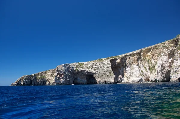 Nice Blue Grotto view in Malta island from seaside with clear blue sea background, touristic destination in Malta, Europe. Scenic place, maltese nature