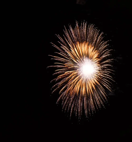 Golden orange amazing fireworks isolated in dark background close up with the place for text, Malta fireworks festival, 4 of July, Independence day, New Year, explode