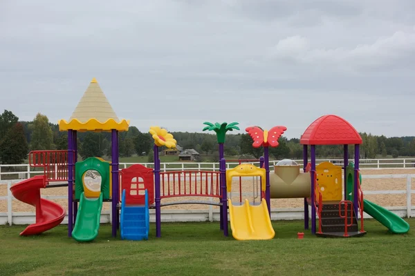 Set of modern kids playground, place for children game. Children garden area in blurry morning background. children Stairs Slides equipment