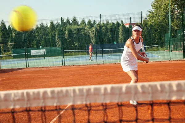 Pretty Female Tennis Player Playing a Match