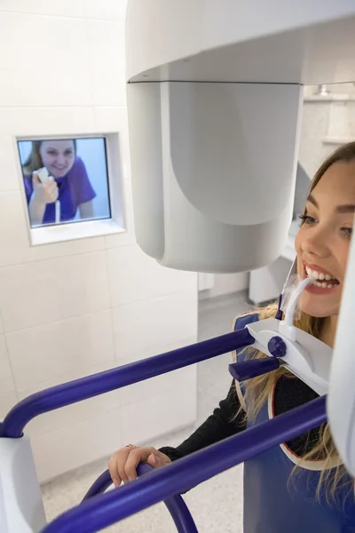 Young Woman Having Panoramic Digital X-ray Of Her Teeth