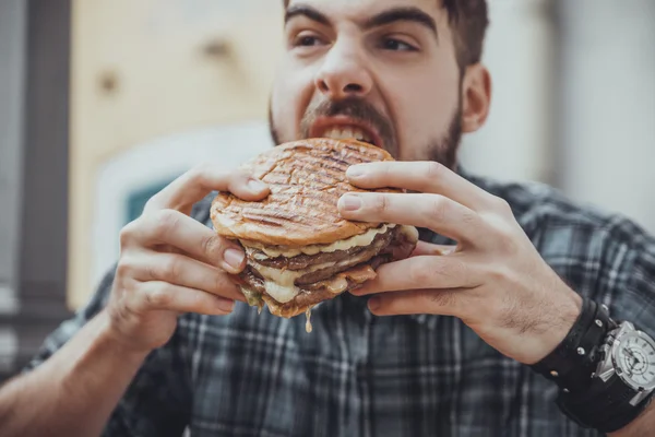 Male Eating Burger