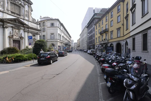 Street of Milan city with cars