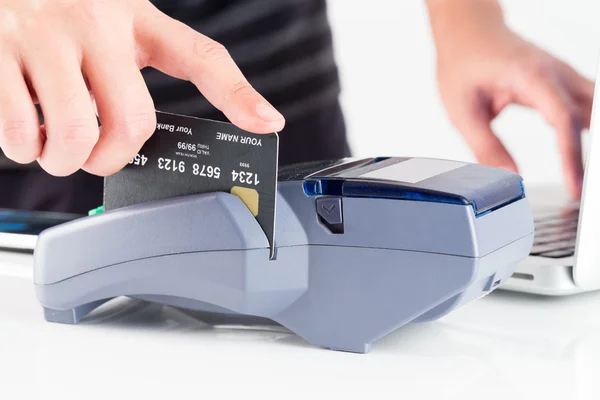 Hand Swiping Credit Card In Store