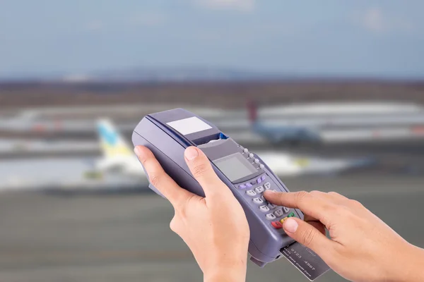 Hand with credit card swipe through terminal for sale airplane t