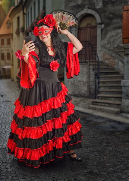 Full length portrait of flamenco dancer with mask