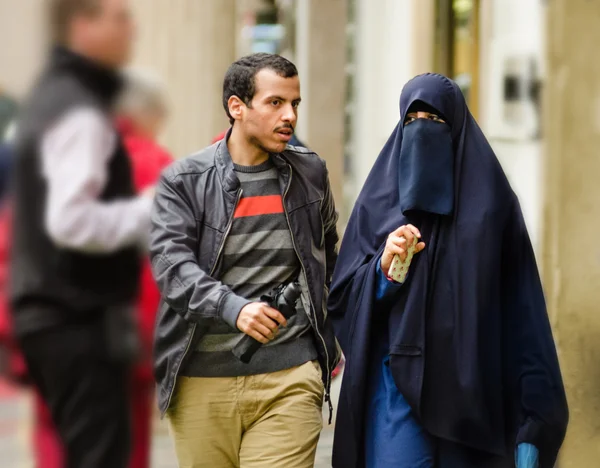 Young Muslim couple walking in Old Prague
