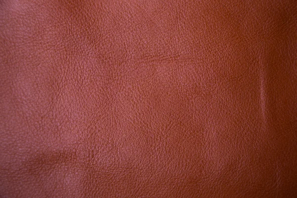 Genuine brown textured cow leather background