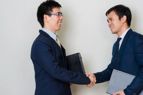 Asian businessmen handshaking after successful start up business