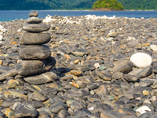 Pyramid of stones row on the beach