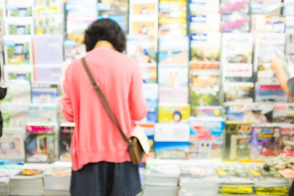 Blur image of People reading and shopping book