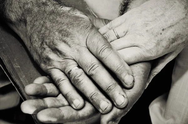 Monochrome image of old married couples hands. horizontal