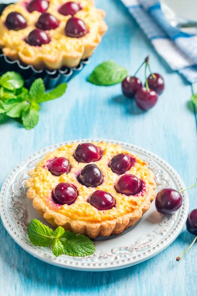 Small tarts with fresh cherries
