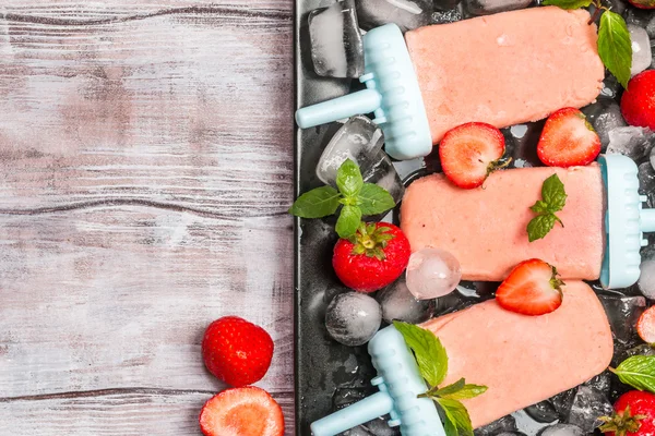 Homemade strawberry ice cream or popsicles