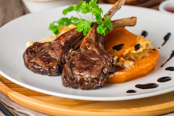 Roasted lamb ribs with  grilled pumpkin