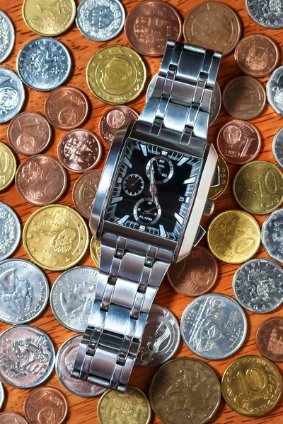 Men\'s wrist watch on metal coins