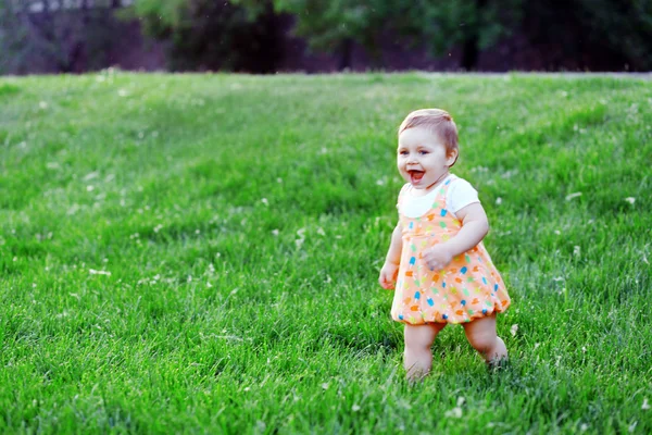 Happy child runs to his mother. The child has fun in nature. Activities with children. Free child. Genuine joy. Kids Games, happiness.A child runs. Merging with nature.wonderful world through the eyes of a child.