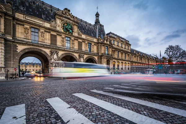 Traffic moving past the Porte Des Lions, in Paris, France.